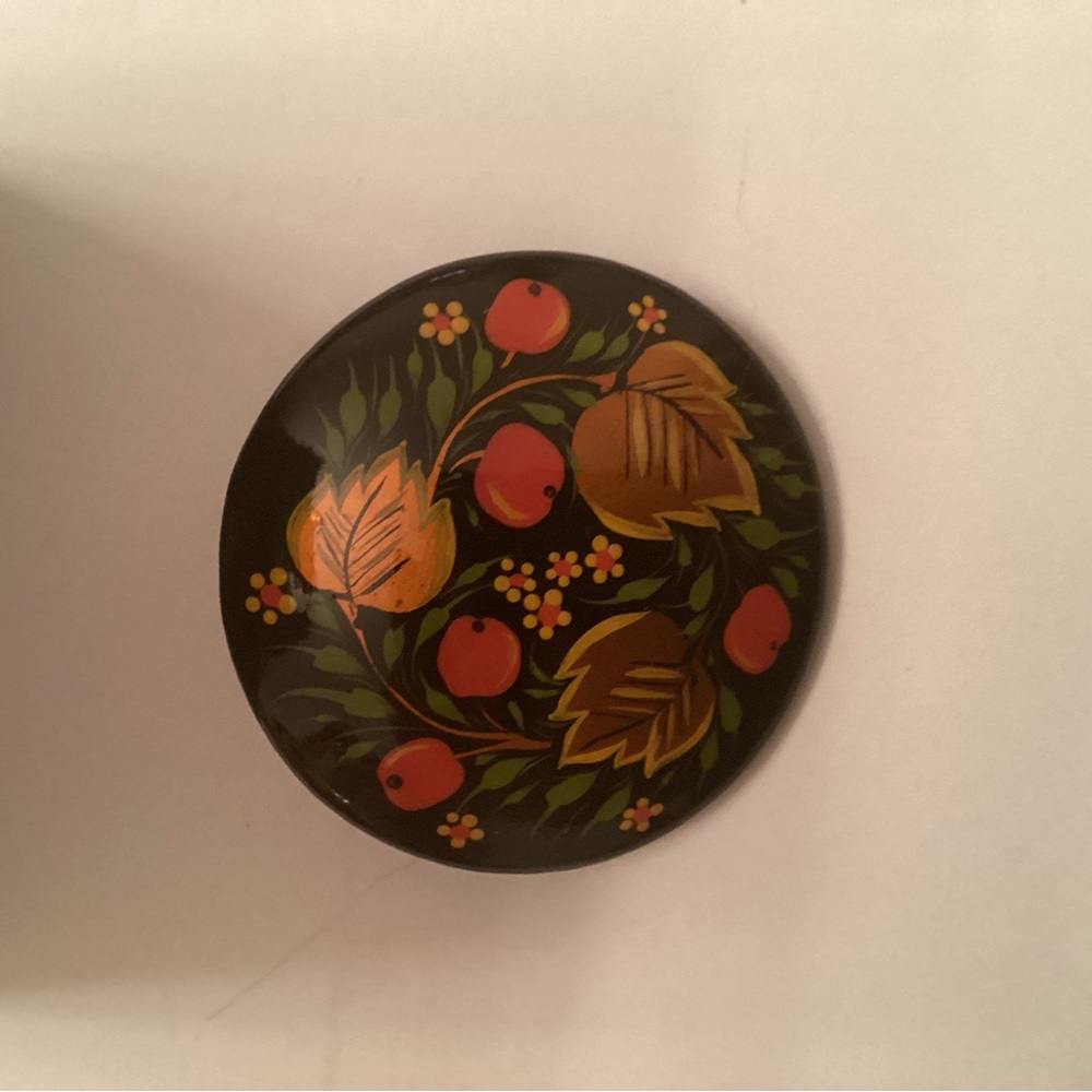 Russian pin with black background colorful abstract flowers